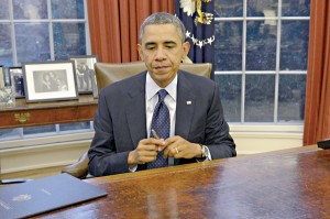 US President Barack Obama signs a series of bills in the Oval Office of the White House