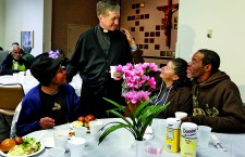 CHICAGO ARCHBISHOP VISITS WITH CATHOLIC CHARITIES PATRONS FOR THANKSGIVING DINNER