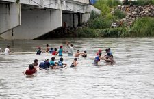 Honduran migrants cross the river that separates Guatemala and Mexico, Tecum Uman - 20 Oct 2018